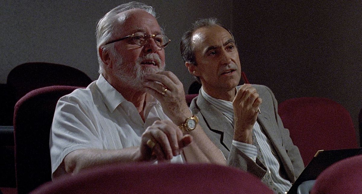 John Hammond e il suo avvocato Gennaro guardano il video esplicativo del DNA in Jurassic Park