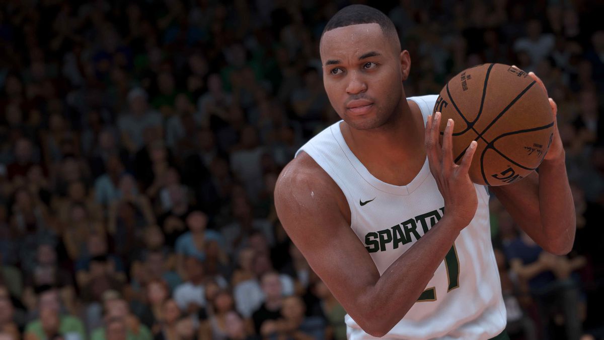 Un giocatore fittizio dei Michigan State Spartans culla un pallone da basket in NBA 2K21