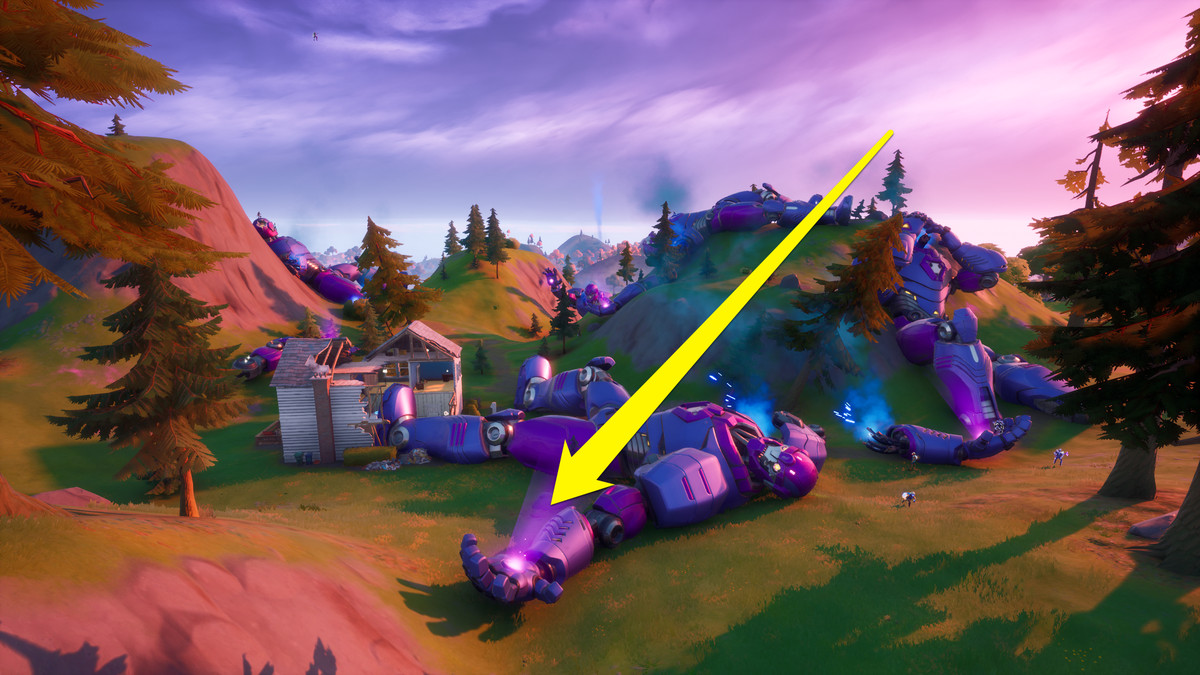 Una Sentinella morta a Fortnite con una freccia che punta alla sua mano