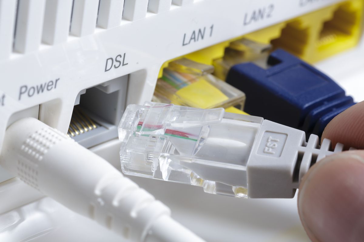 plugging a network cable into a DSL port on a router