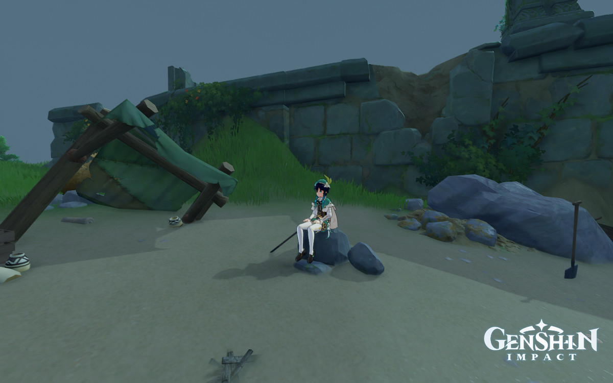 Venti siede su una roccia presso un accampamento abbandonato