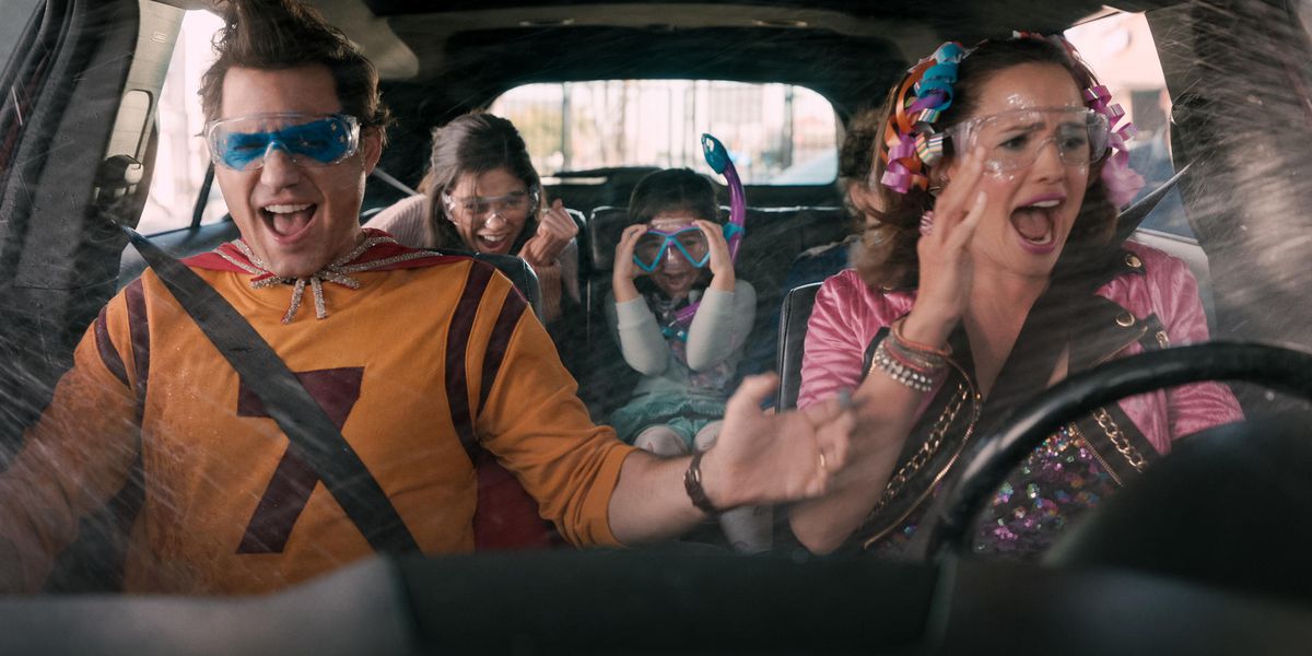 a family in a car with some kooky costumes