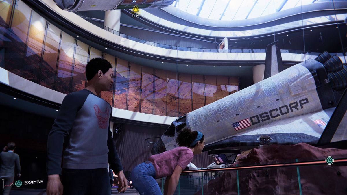 miles e phil guardando una mostra scientifica in un museo