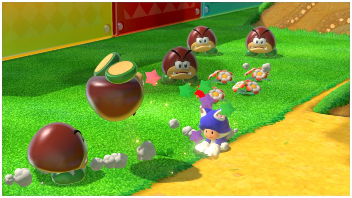 Rospo, che indossa un costume da gatto, colpisce un goomba nell'oblio. Altri quattro goomba guardano la violenza, i loro volti vuoti tradiscono il loro terrore.