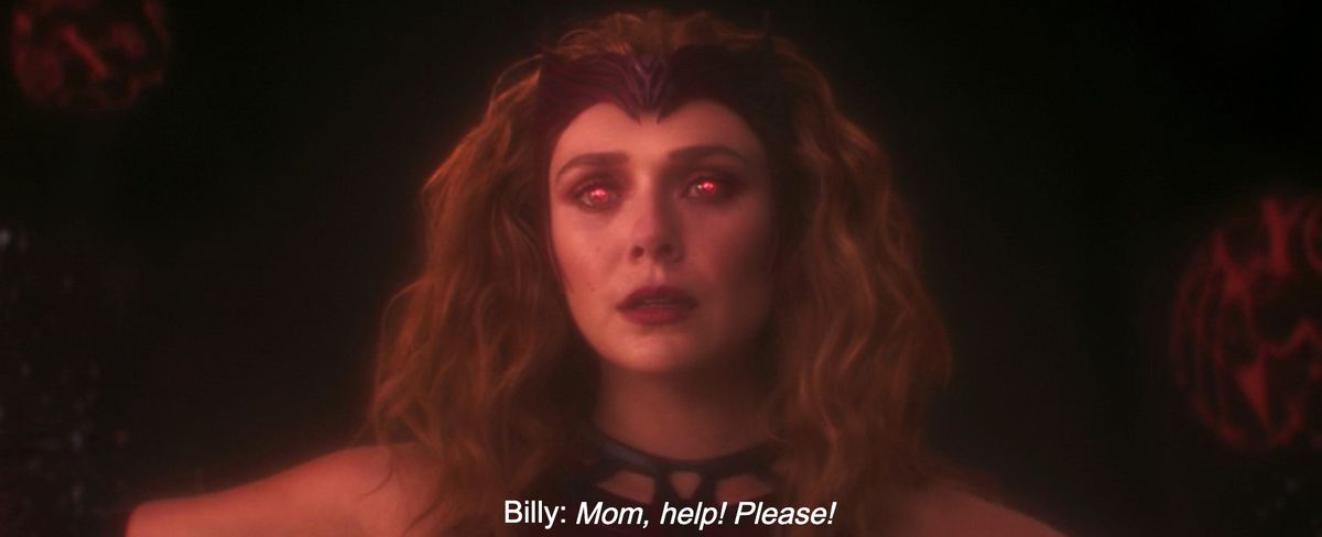 Scarlet Witch esegue la magia con gli occhi rosso vivo e il classico costume addosso mentre sente suo figlio Billy gridare โMamma, aiuto! Per favore!
