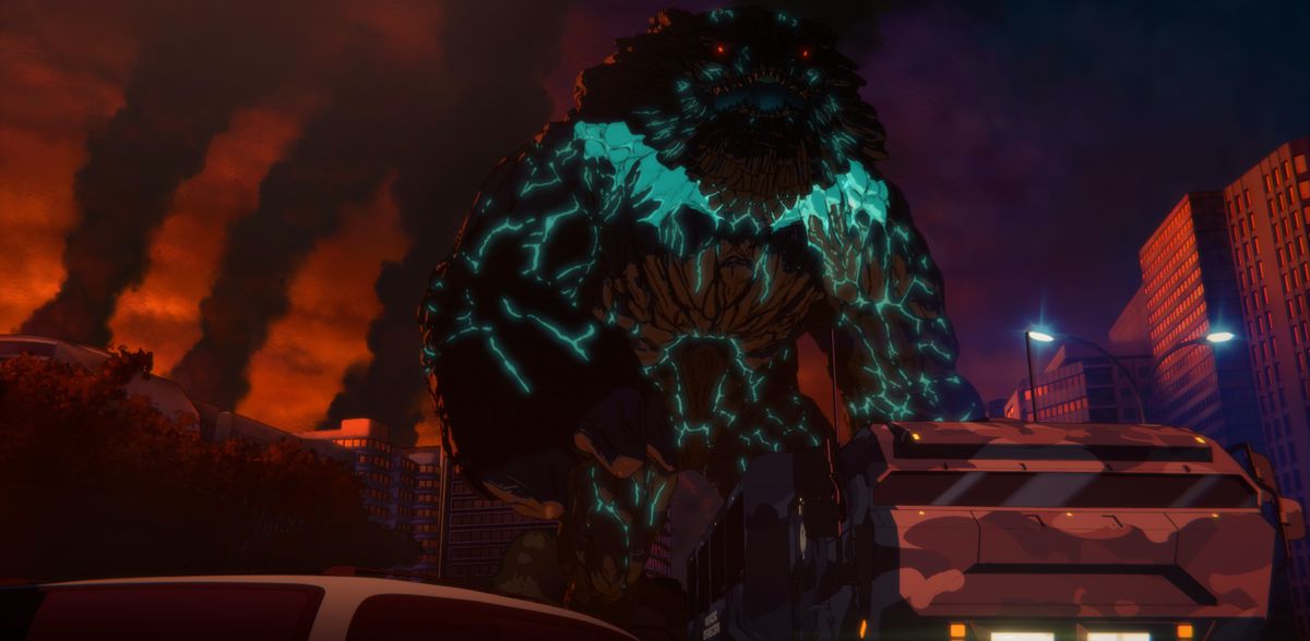 Un grande, gocciolante kaiju nero e verde con piccoli occhi rossi luminosi in Pacific Rim: The Black