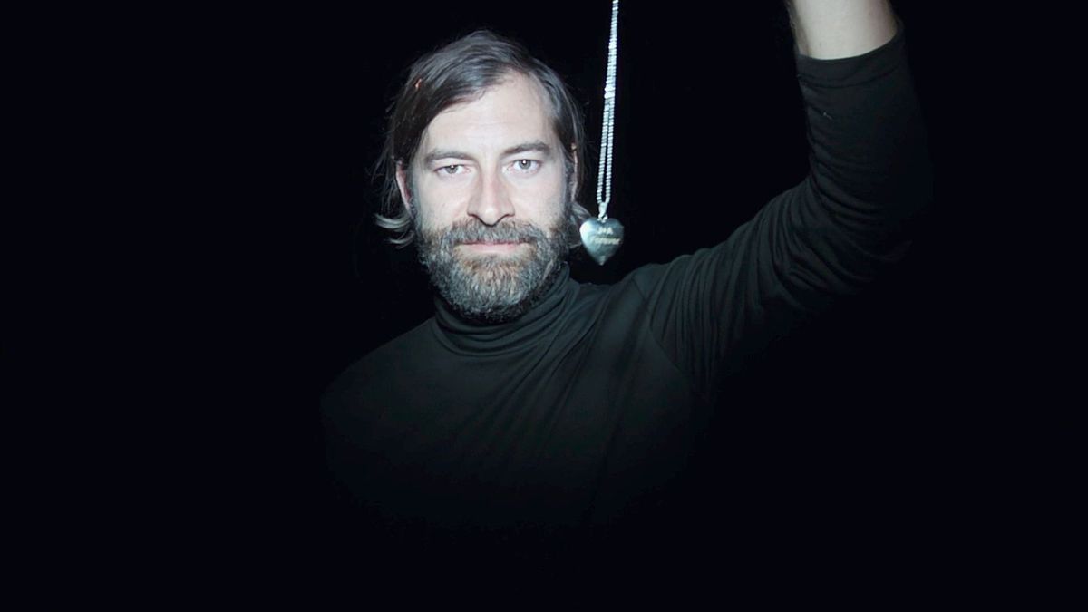 Creep 2 - Mark Duplass holds a necklace