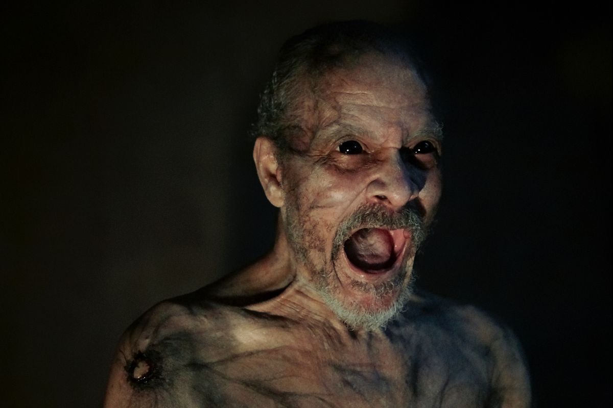 Angry black-eyed grandpa screaming in It Comes At Night