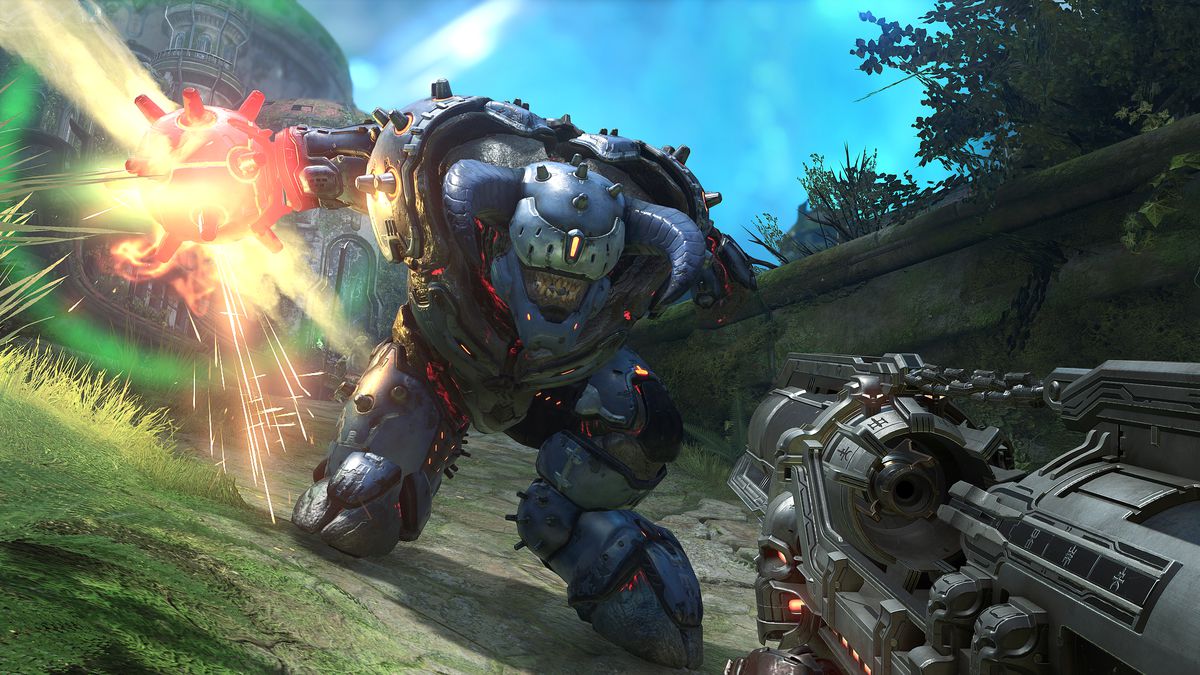 Un enorme demone che indossa un'armatura potenziata attacca il Doom Slayer