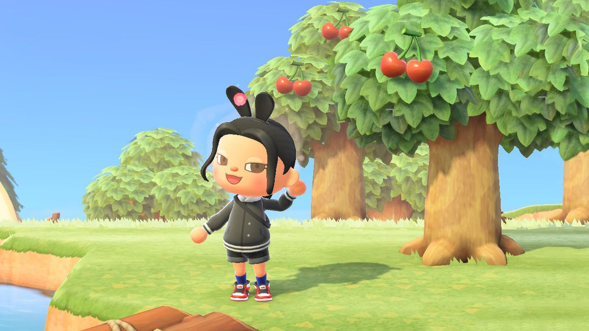 An Animal Crossing character wearing rabbit ears blushes by some trees