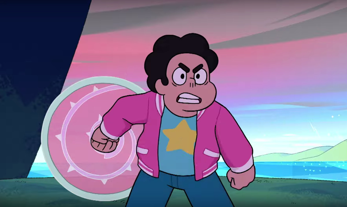 Un arrabbiato Steven Universe stringe i denti e alza il suo scudo energetico rosa in Steven Universe: The Movie