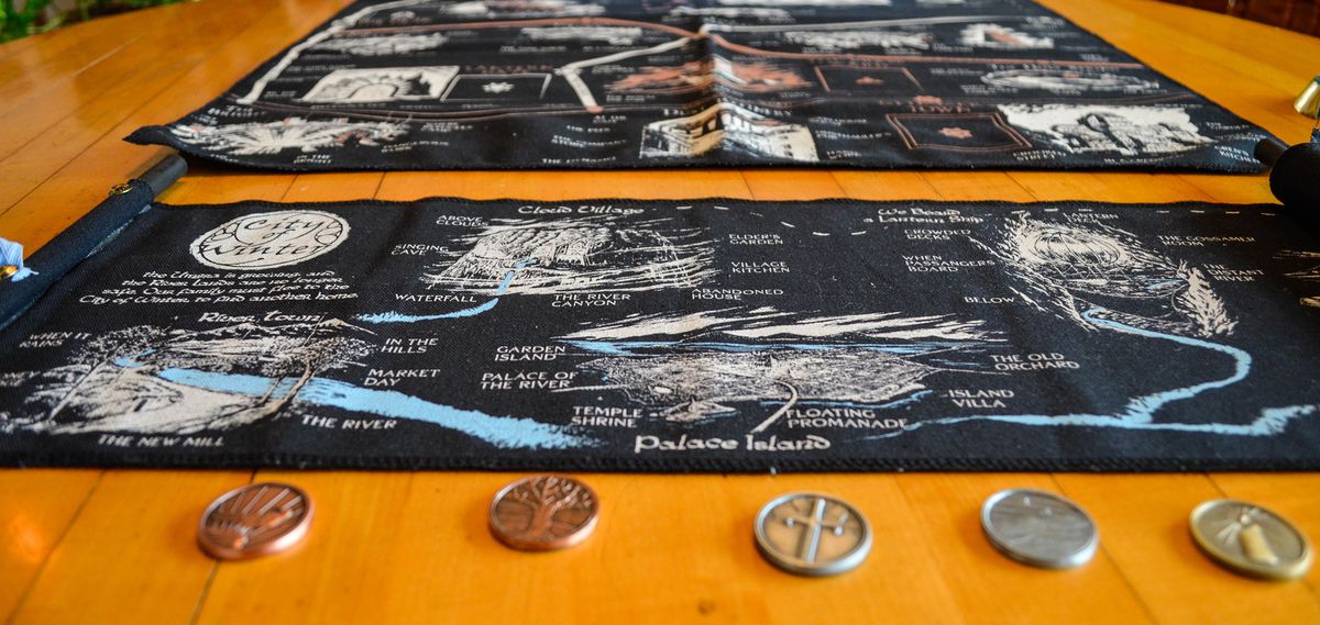 A City of Winter demo set, with scroll, map, and character tokens