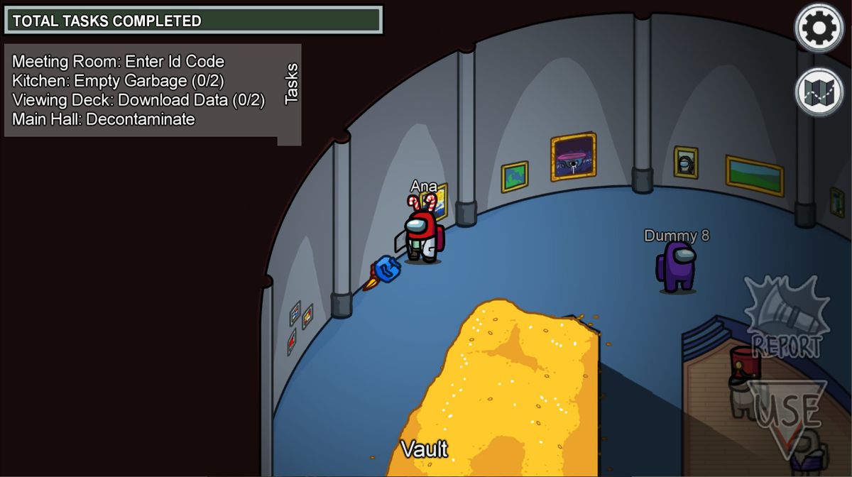 Un fagiolo animato compagno di squadra in piedi accanto a un branco blu e quello che sospettiamo sia un uccello morto a terra.