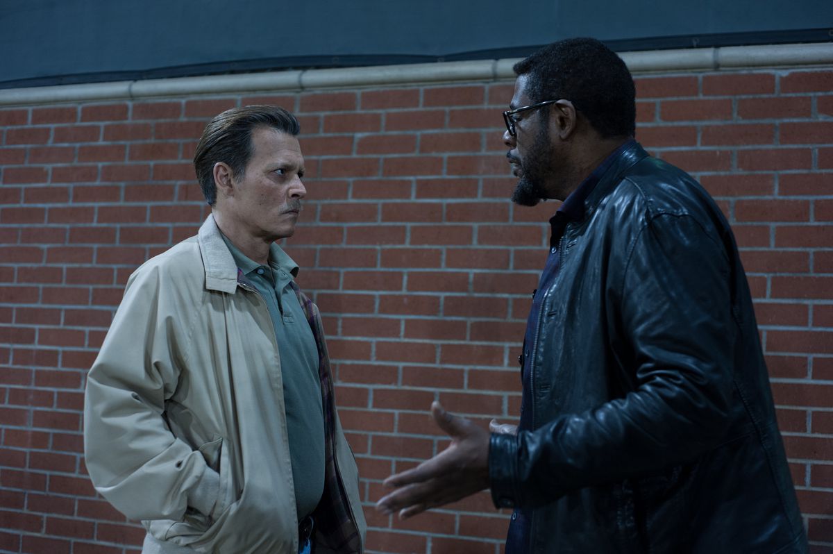 Johnny Depp scowling at Forest Whitaker in City of Lies