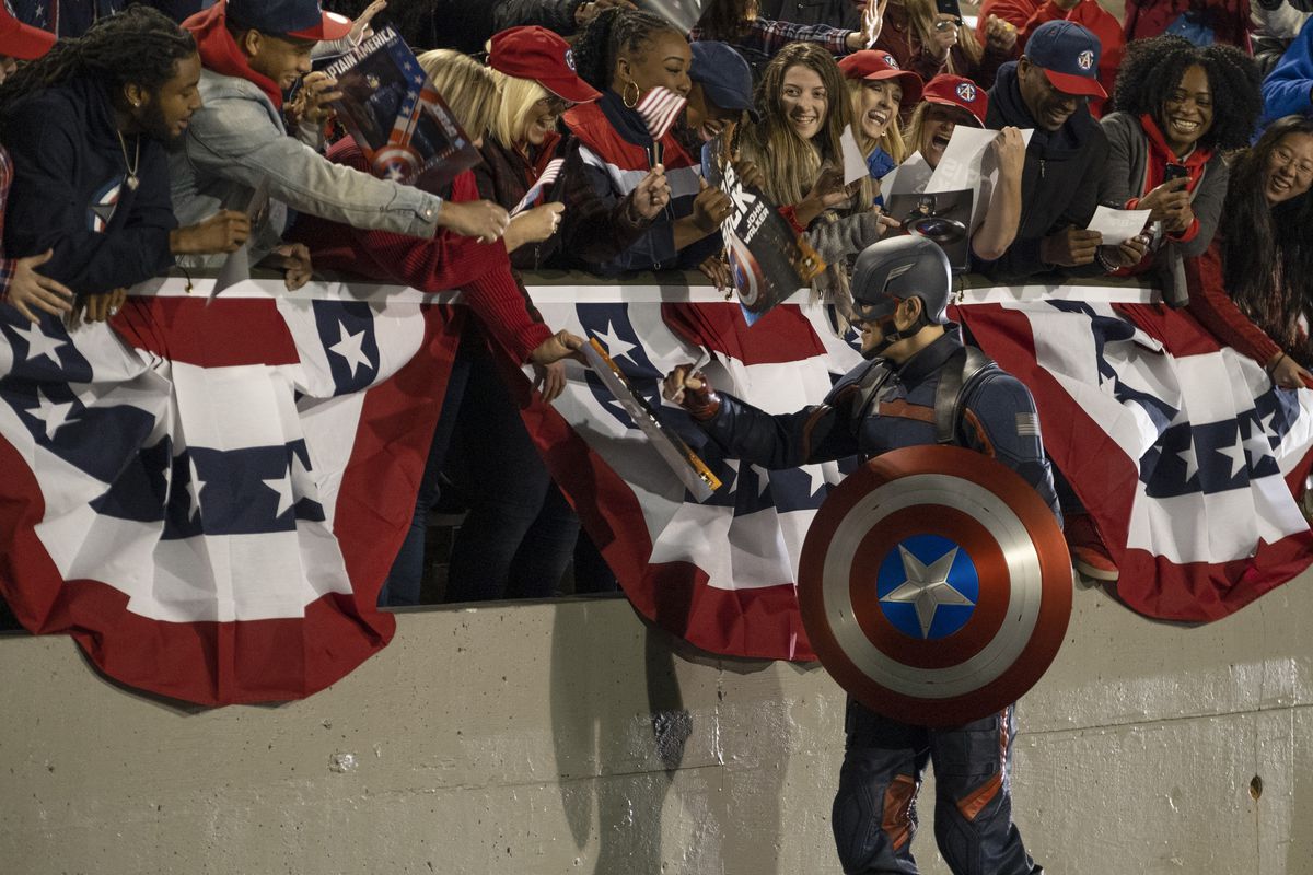 John Walker (Wyatt Russel) greeting a crowd of adoring onlookers as the “new” Captain America in Marvel Studios’ THE FALCON AND THE WINTER SOLDIER