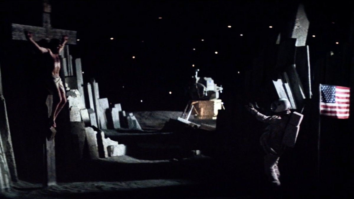 An astronaut happens upon the crucifixion of Christ while walking across the surface of the moon.