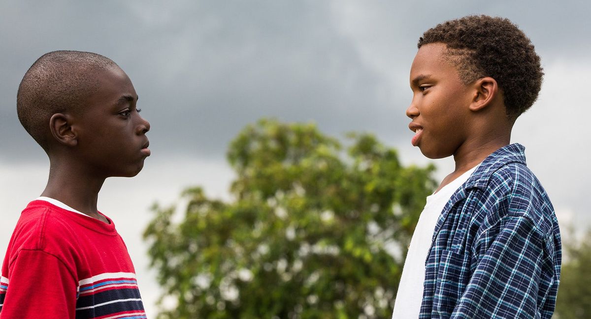 Two Black boys face each other in Moonlight