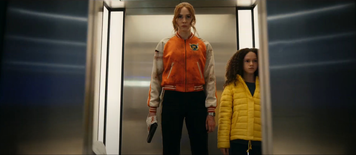 Karen Gillan in an elevator with a gun in Netflix’s Gunpowder Milkshake