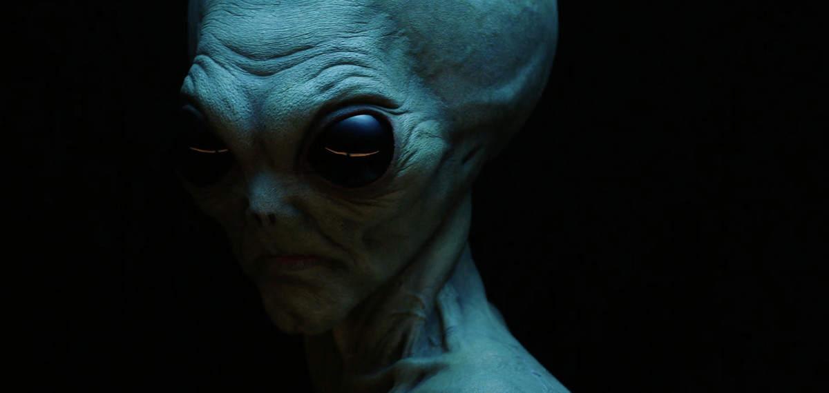 a creepy alien set against a black background