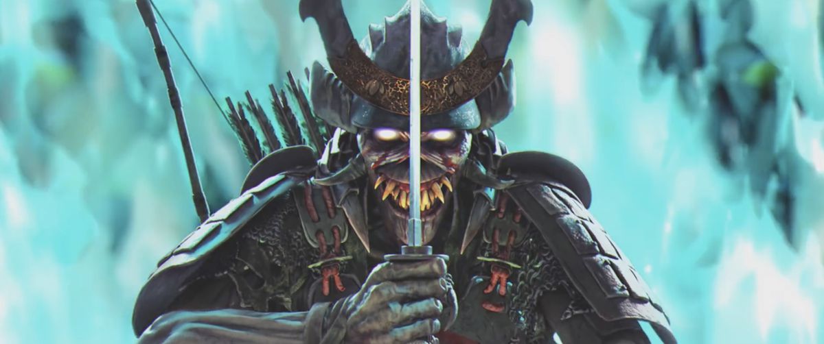 Samurai Eddie holds up his sword standing near blue fire in Iron Maiden’s The Writing on the Wall music video