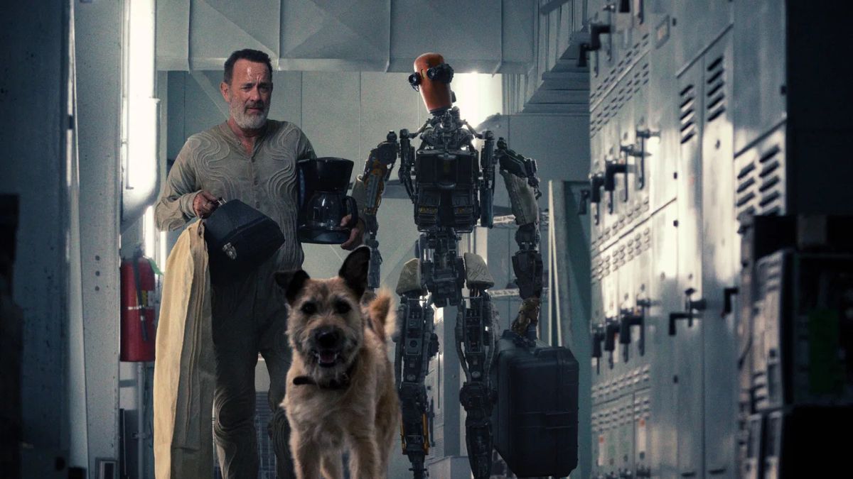 Finch (Tom Hanks) walks besides his robot Jeff (Caleb Landry Jones).