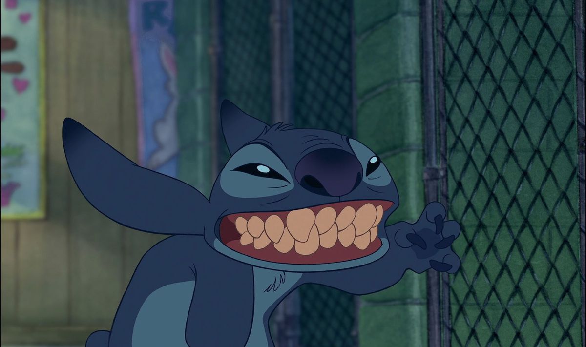 stitch with a toothy grin waving 