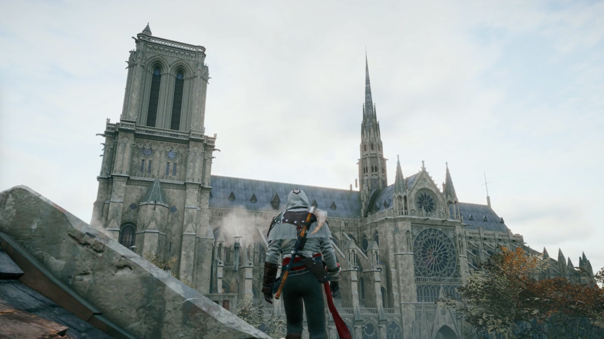 Arno standing on a rooftop and looking at Notre-Dame cathedral in Assassin’s Creed Unity