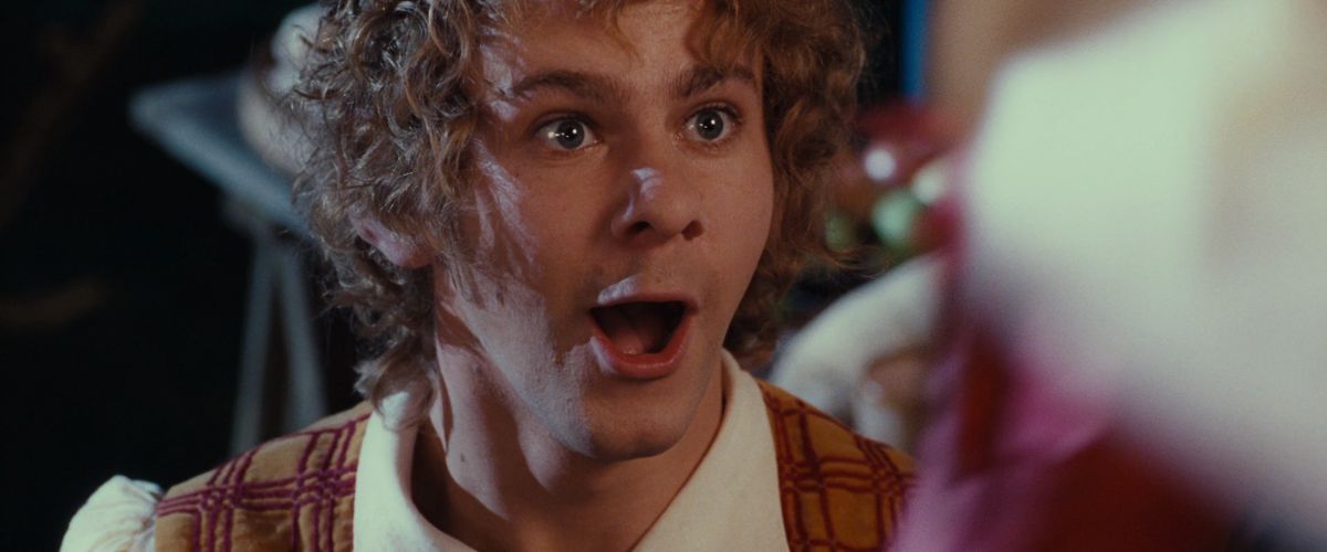 Merry, played by Dominic Monaghan, smiling as he’s about to get into some mischief.