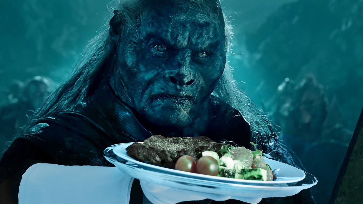 Orc waiter presenting a steak dinner