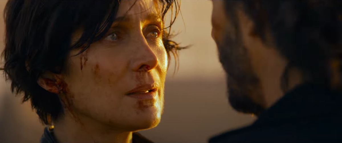 Trinity looks at Neo in this image from The Matrix Resurrections