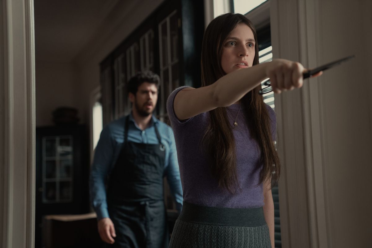 Toby Kebbell and Nell Tiger Free holding a knife in Servant season 3