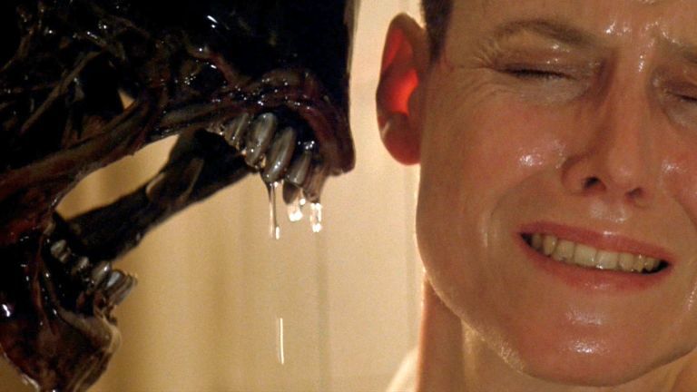 The Xenomorph inches towards a shirking Ripley in Aliens 3