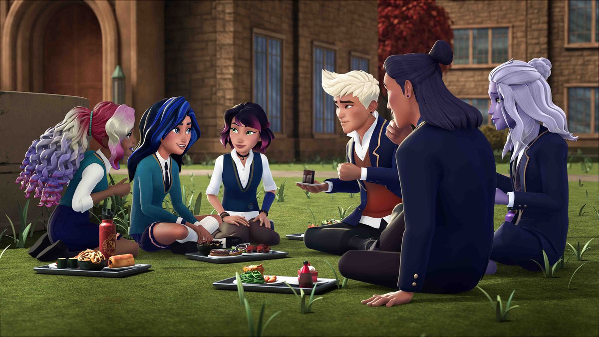 un gruppo di studenti magici si siede sul prato