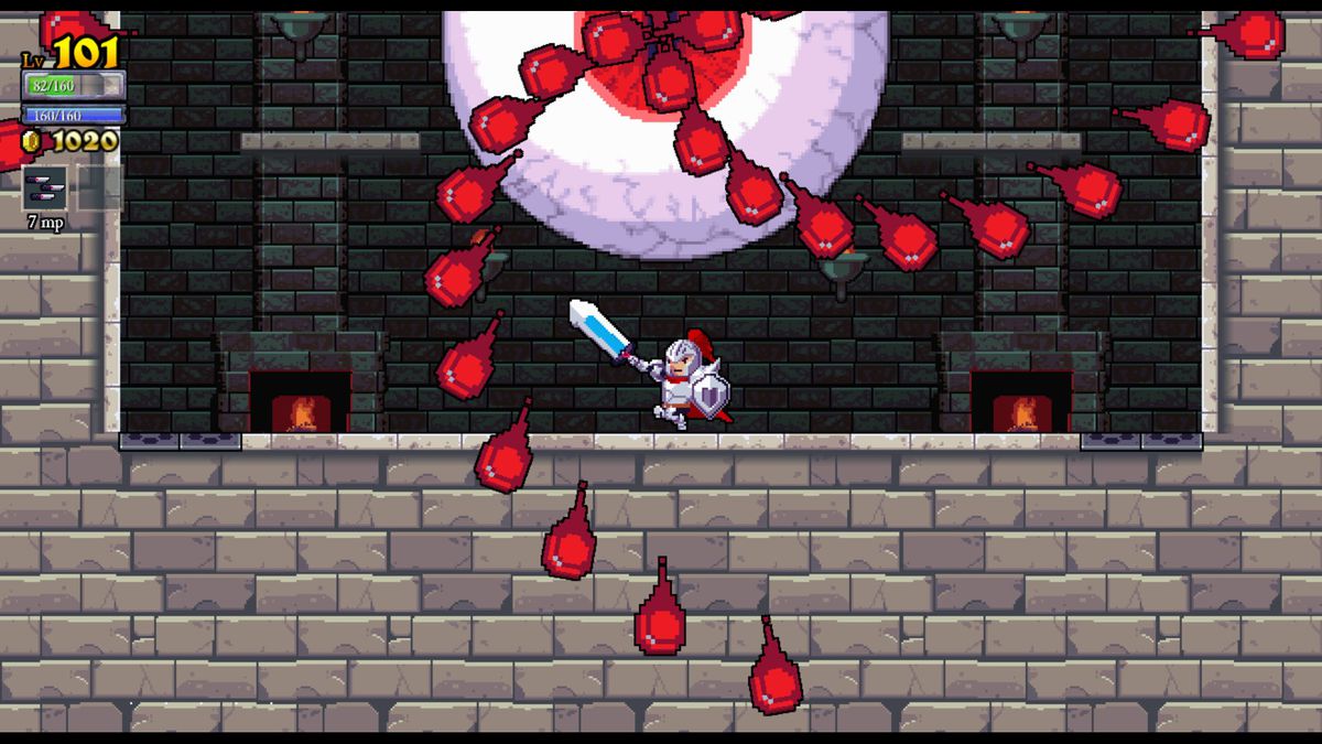 Un cavaliere combatte un bulbo oculare gigante in una prigione in uno screenshot di Rogue Legacy
