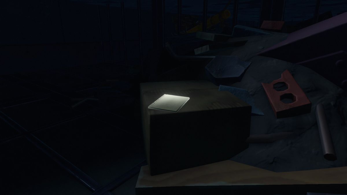 Una nota si trova su una scatola attorno a tonnellate di macerie