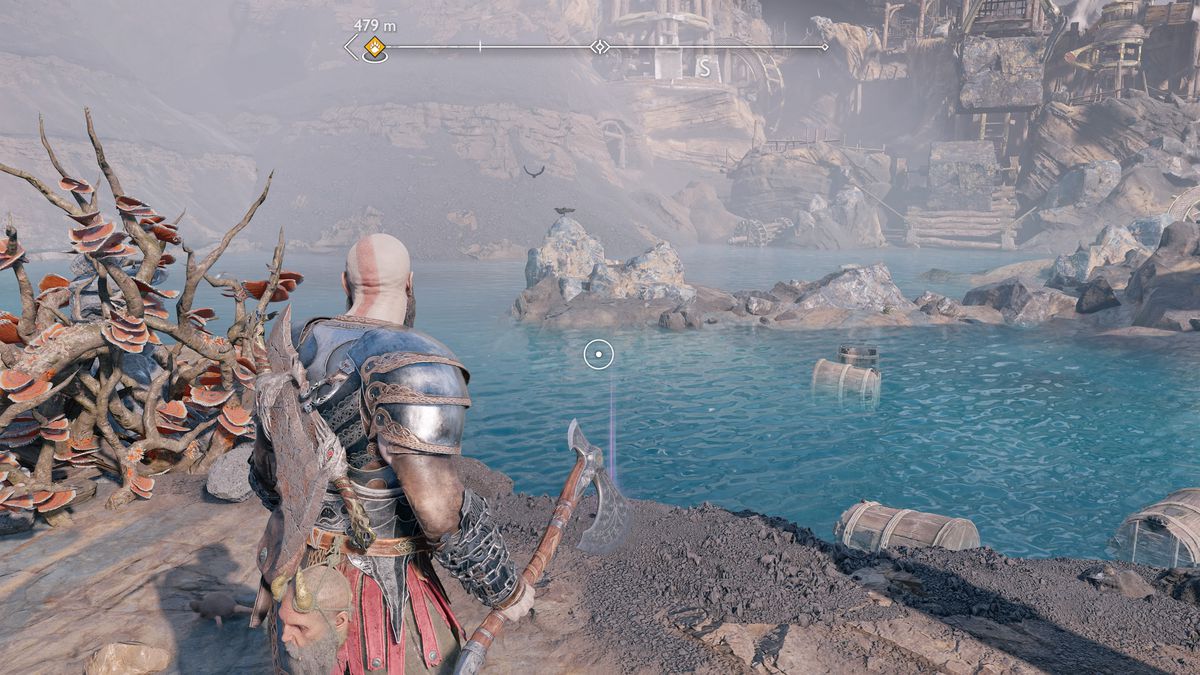 Kratos raccoglie un artefatto in God of War Ragnarök