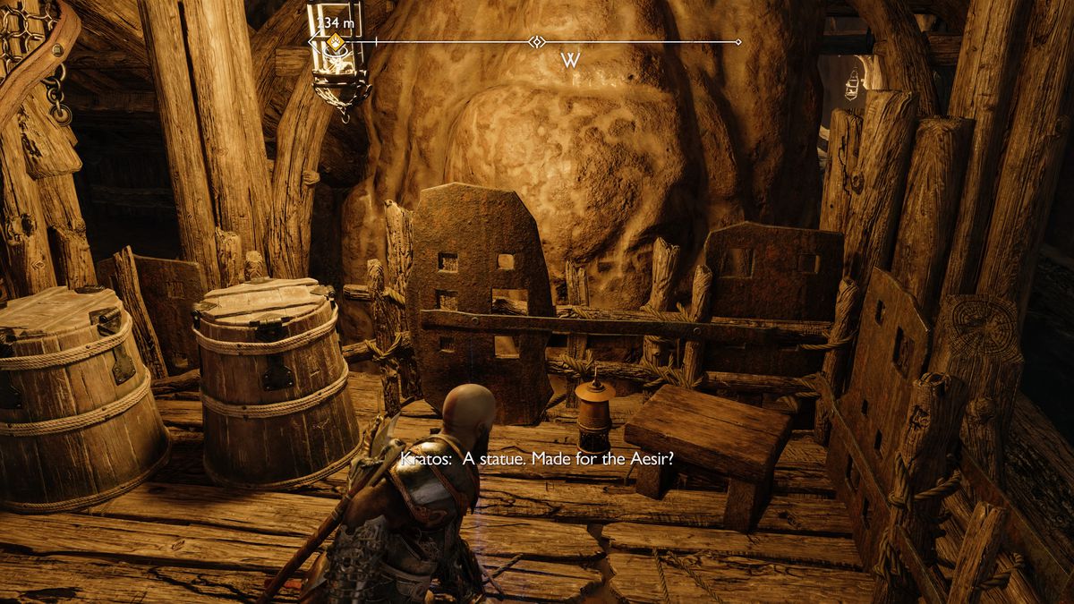 Kratos raccoglie un artefatto in God of War Ragnarök