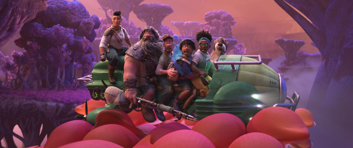 Cinque membri dell'equipaggio steampunk siedono su un hovercraft verde in un mondo sotterraneo dai toni del rosso