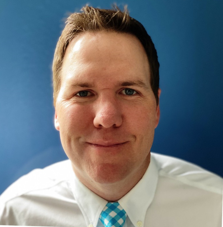 Colpo alla testa pubblicitario di Ben Ramsour, produttore di EA Sports PGA Tour, datato 2023