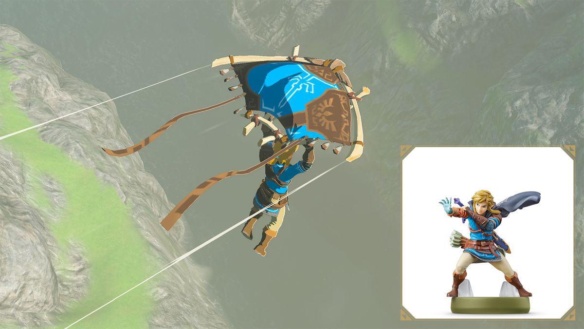 Link scivola su un baratro in Tears of the Kingdom usando un aliante a motivi blu e marroni. L'amiibo Link di Tears of the Kingdom è mostrato nell'angolo in basso.