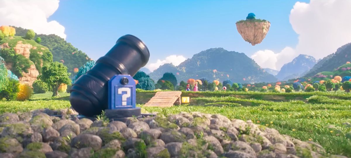 Una ripresa orizzontale della versione di Bob-omb Battlefield del film The Super Mario Bros., con un cannone in primo piano e Mario, Peach e Toad sullo sfondo
