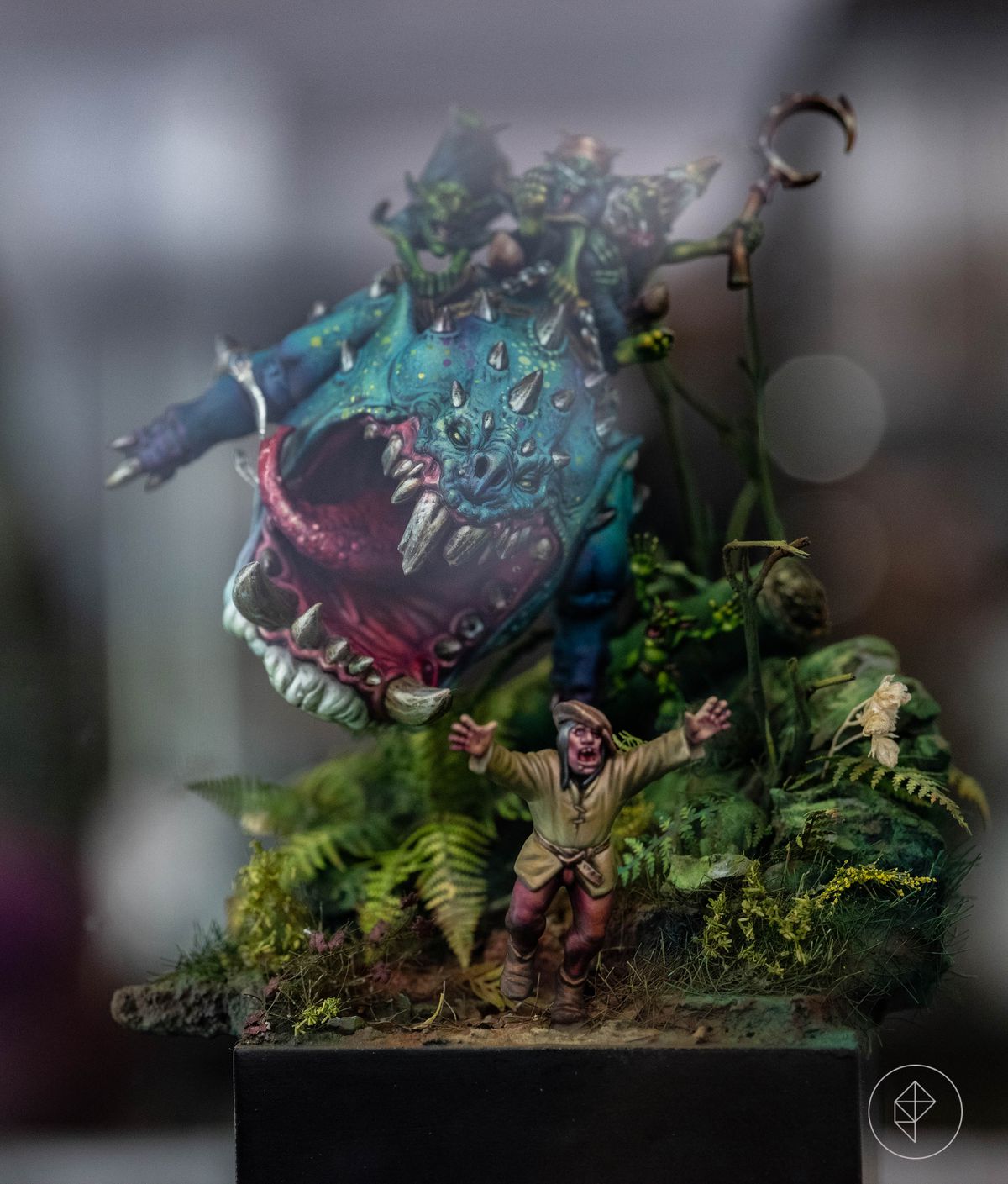 A giant squig — a two-legged, rolly-polly fantasy creature with a massive jaw and a lolling tongue — rampages through the underbrush, chasing a villager. The foliage is vibrant and realistic, with many different shapes and layers.