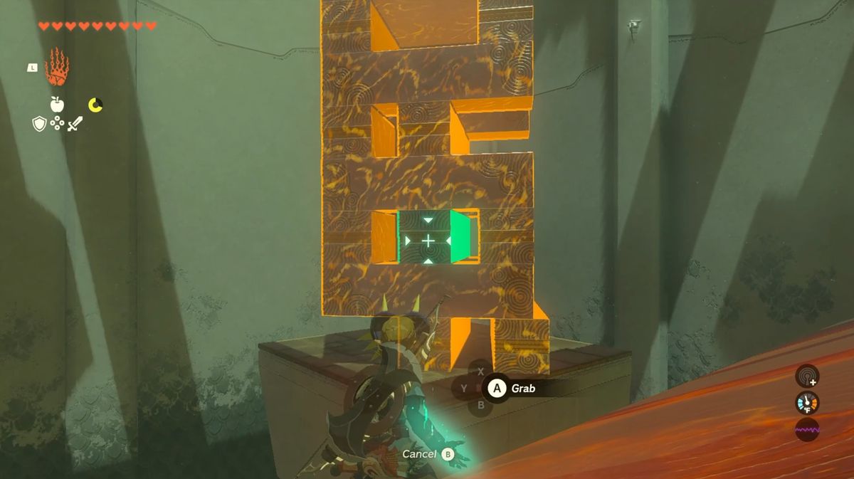 Link evidenzia una torre di blocchi con la sua abilità Ultrahand in Zelda: Tears of the Kingdom.  Il blocco al centro della terza fila è verde brillante, mentre il resto è arancione.
