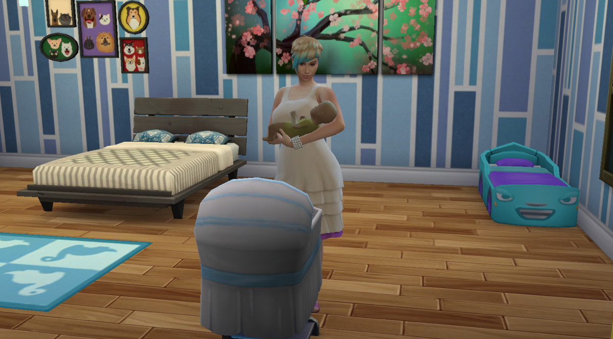 The Sims 4 - una madre tiene in braccio il suo bambino
