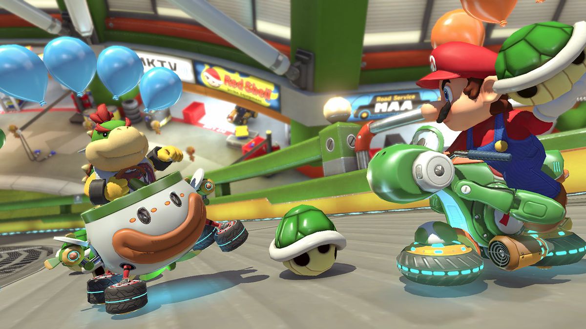 Mario punta un guscio verde contro Bowser Jr. in Mario Kart 8 Deluxe