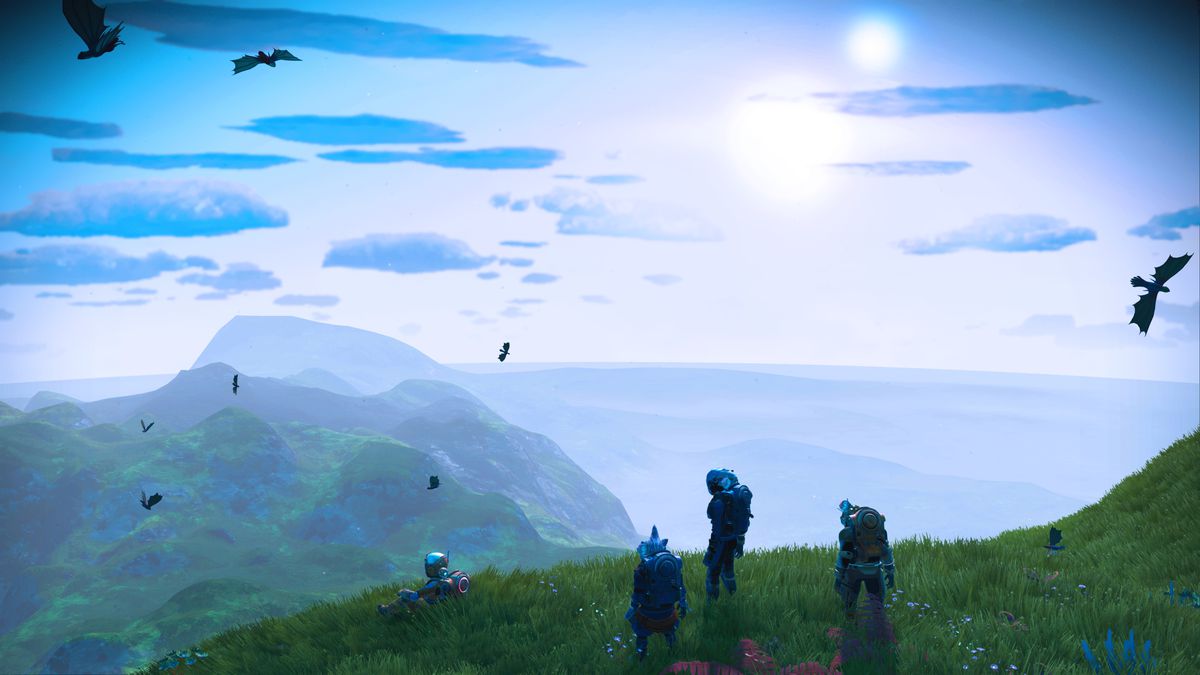 Un gruppo di astronauti guarda il cielo blu in uno screenshot di No Man’s Sky: Origins