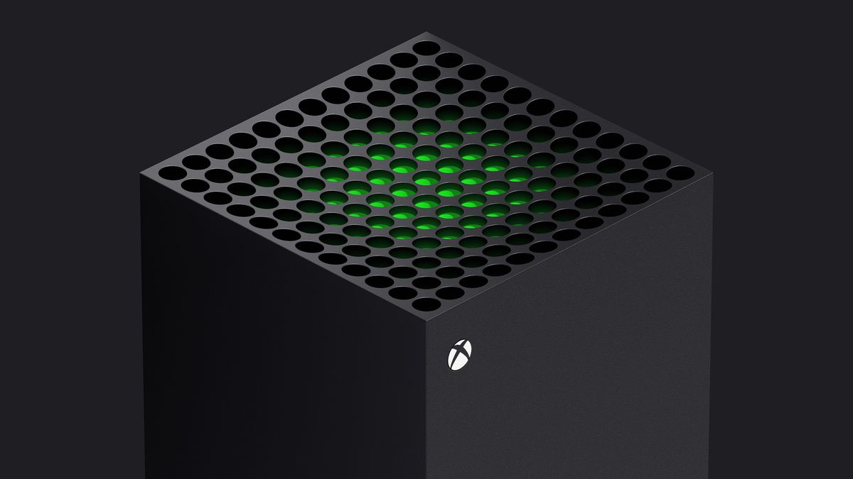 una vista di tre quarti della parte superiore di Xbox Series X, con un pezzo di plastica verde visibile appena sotto le prese d'aria del sistema