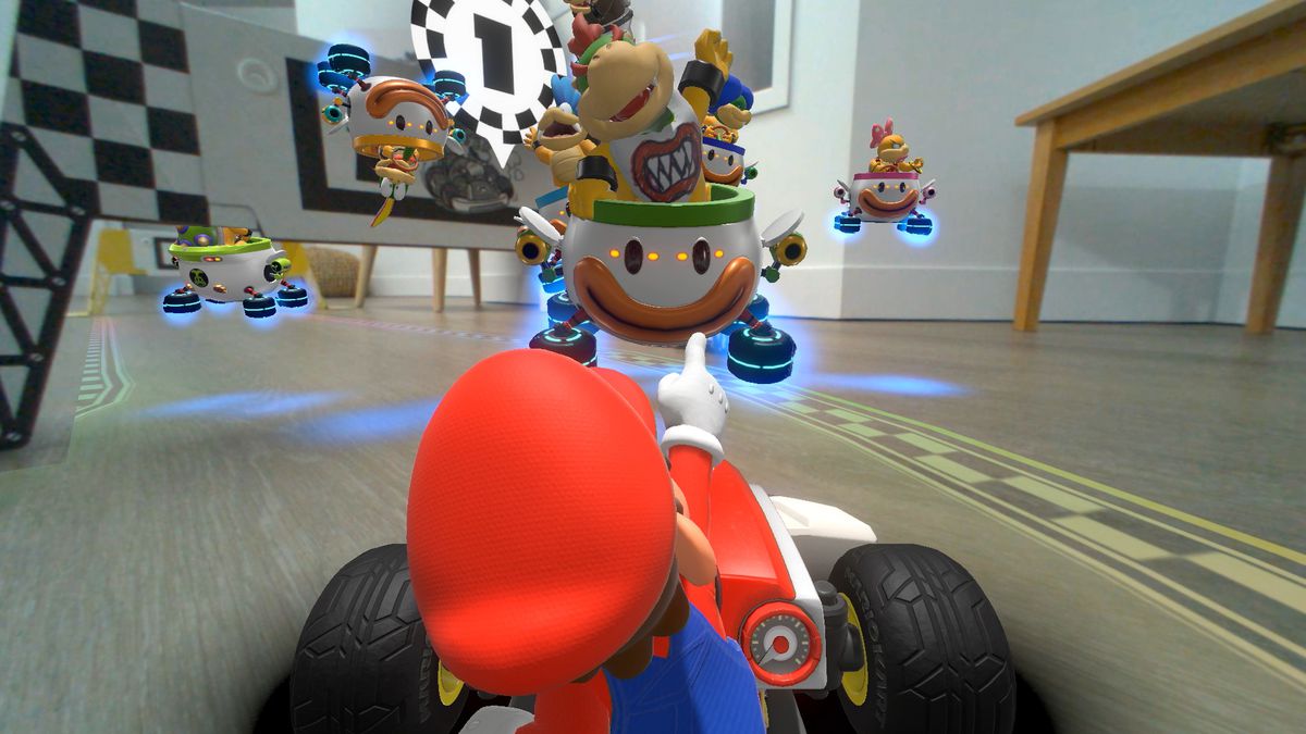 Mario indica Bowser Jr. and the Koopalings in uno screenshot da Mario Kart Live: Home Circuit