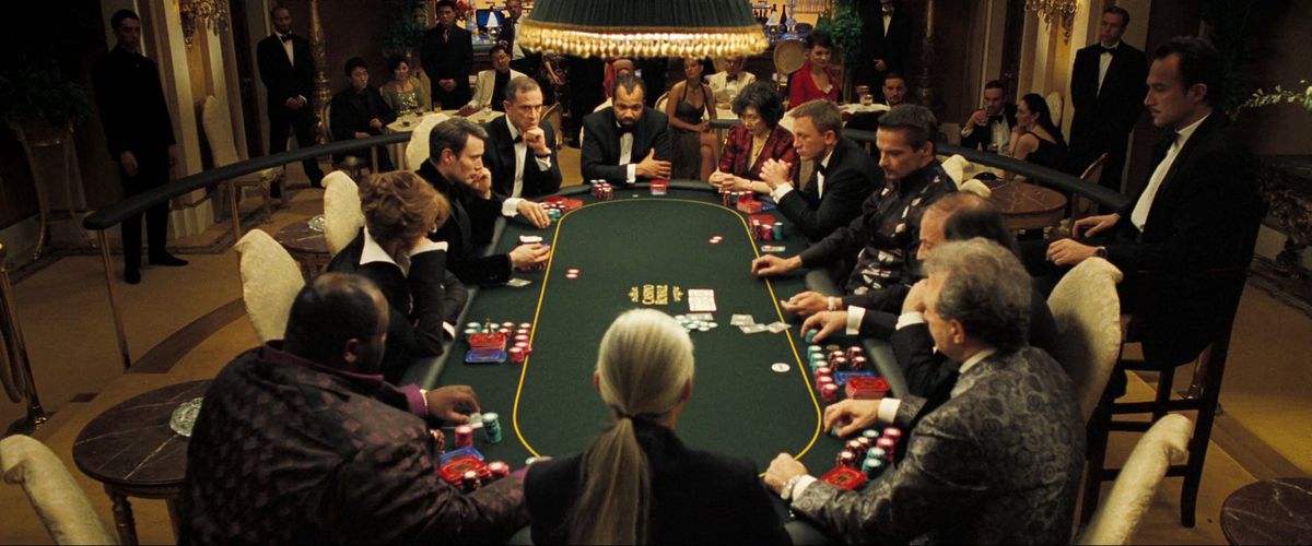 James Bond and his fellow players sit at the poker table in Casino Royale