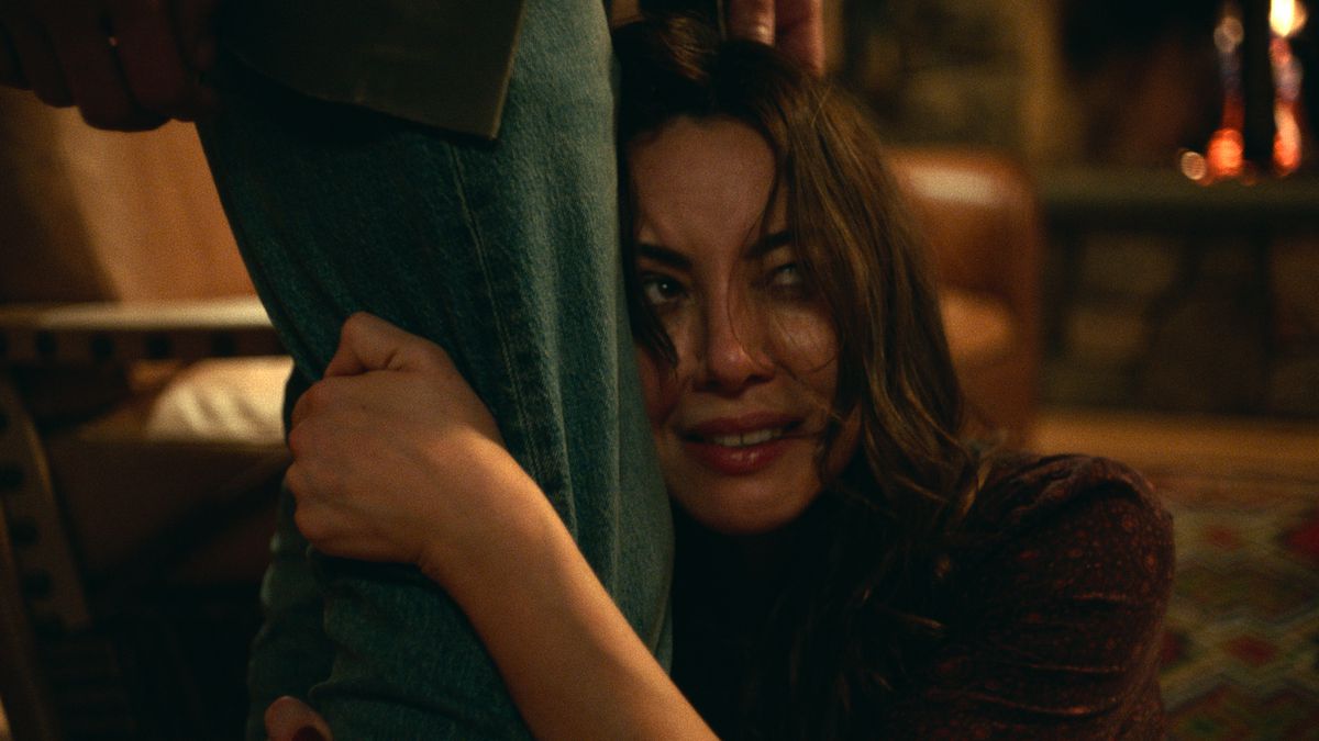 aubrey plaza clinging to a curtain in black bear